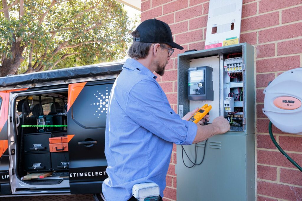 Electrician upgrading a switchboard at a Perth home