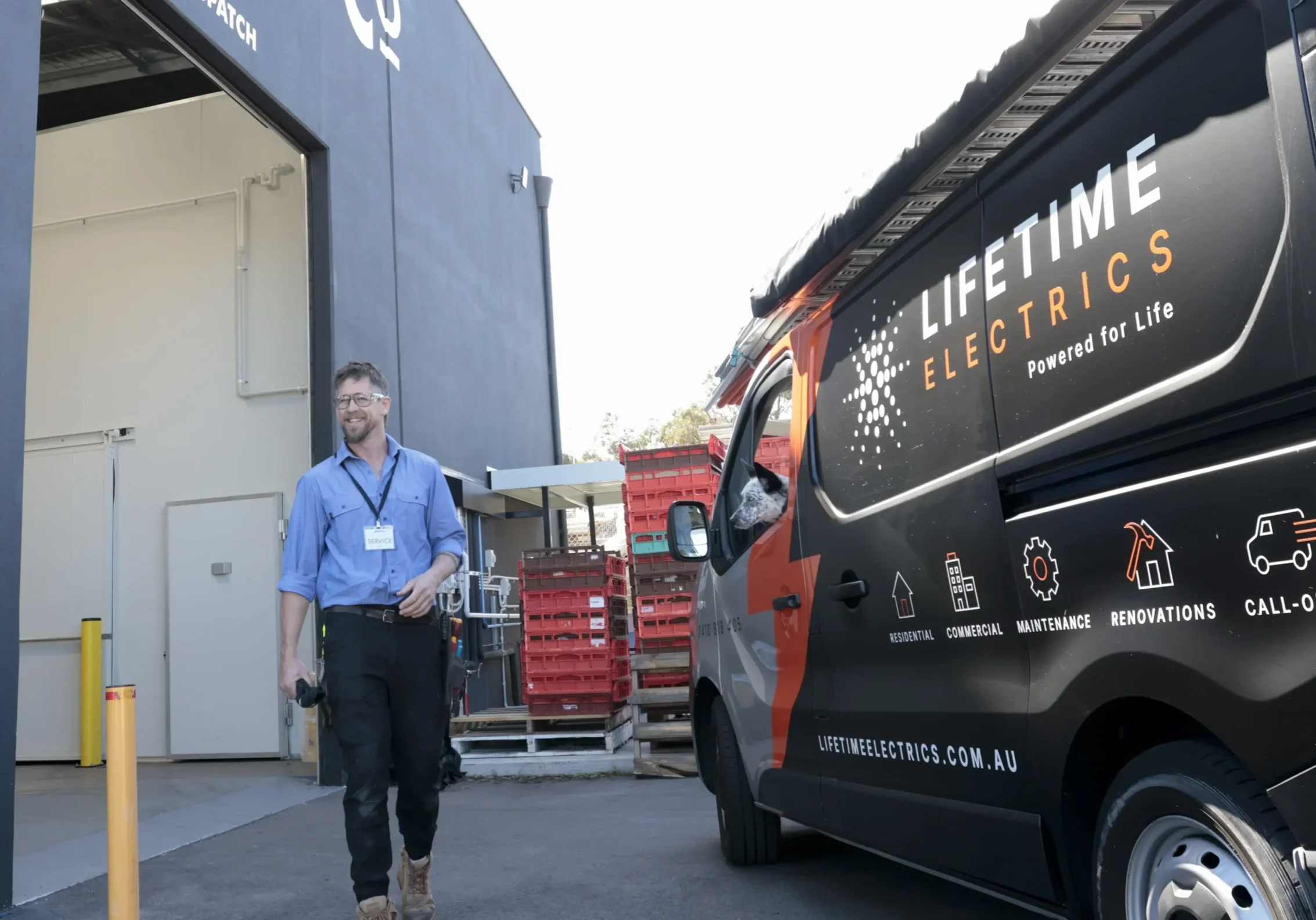 Jay Rawlings walking toward the camera on a commercial electrical job