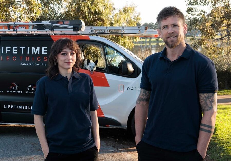 Jay Rawlings and Meg Du Plessis in front of the Lifetime Electrics van
