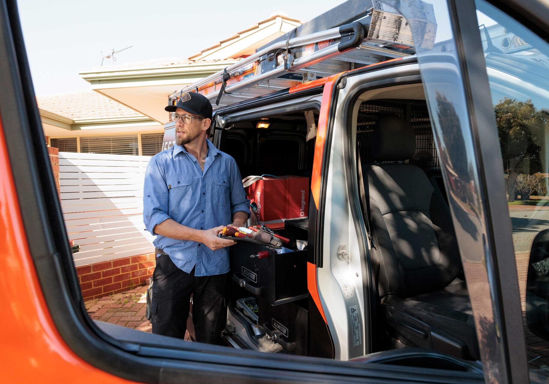 Friendly Perth electrician arriving on site in the Lifetime Electrics van